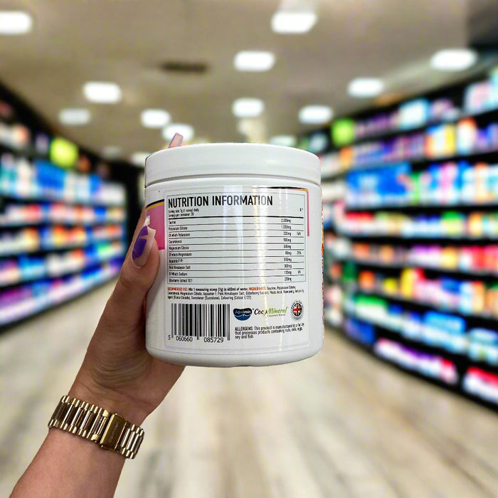 Close-up of (Per4m Hydration Electrolyte Mix 30 Servings) held up inside My Supplement Shop, clearly showing Nutritional Values on the packaging in a Sports Nutrition setting.